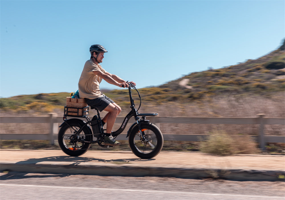 A man riding Tesway folding eletric bike
